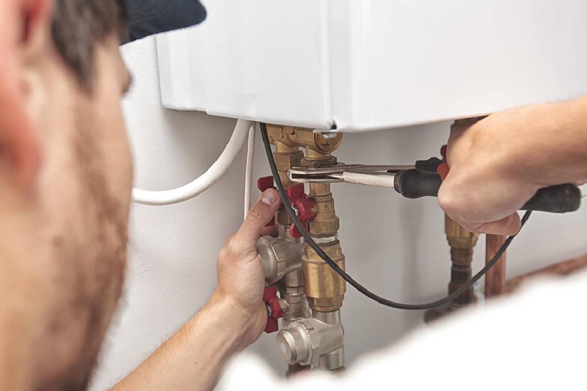 Licensed plumber installing a hot water system in Macarthur NSW